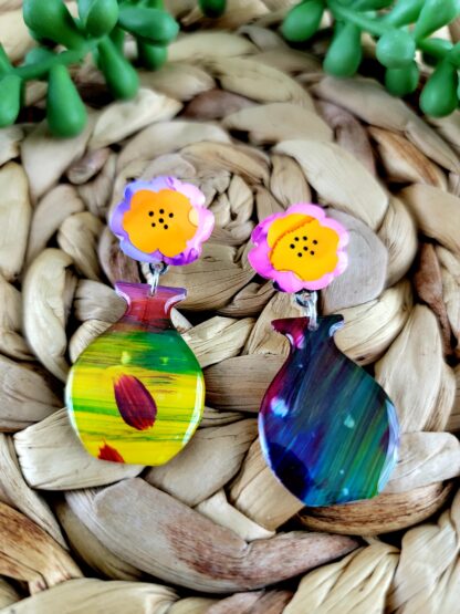 Pink and Purple Flowers in Multicolor Vase - Image 2