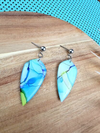 Green, blue and purple daggers